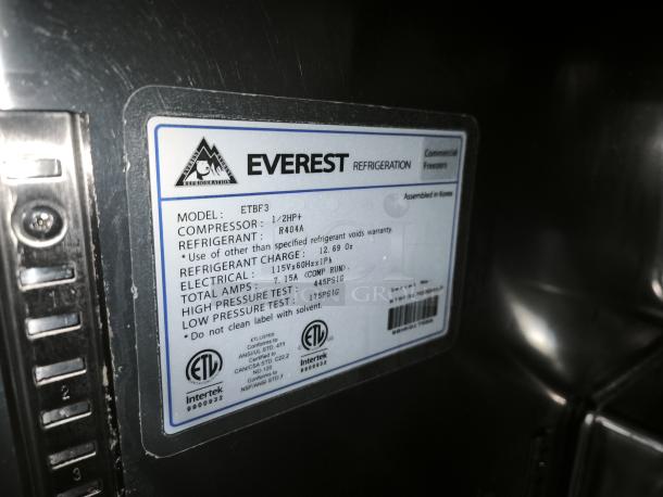 Everest Refrigeration ETBF3 undercounter freezer label showing model, compressor specs, and electrical details.