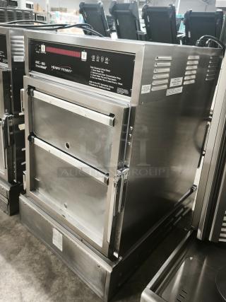 Brand new Henny Penny AHC-993 humidified heated pass-thru holding cabinet, stainless steel, 120V, with visible control panel.