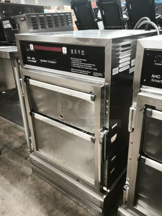 Brand new Henny Penny AHC-993 humidified heated pass-thru holding cabinet, 120V, stainless steel, digital display, dual doors.