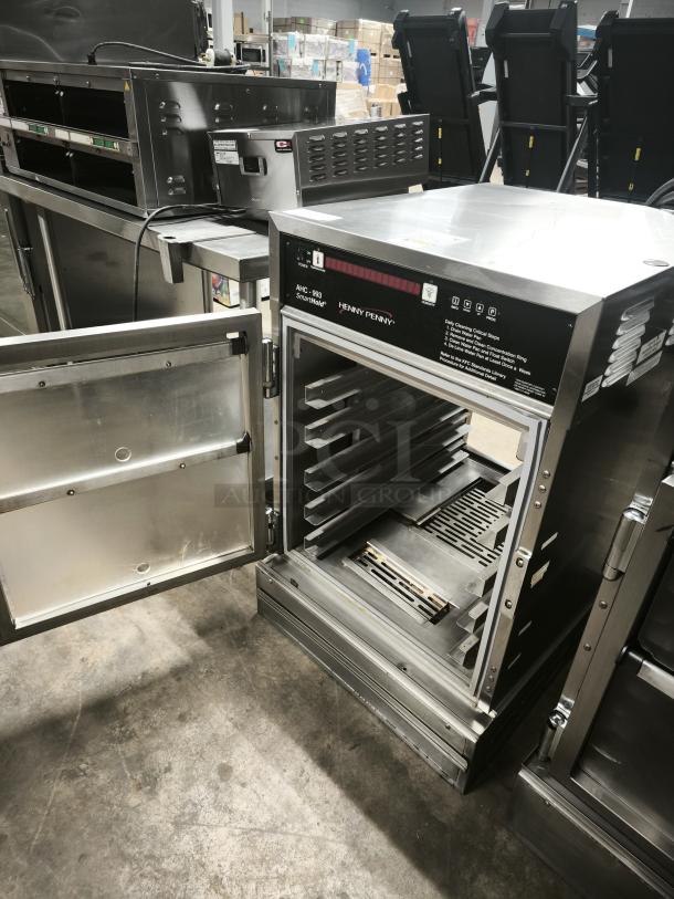 Henny Penny AHC-993 humidified heated cabinet, brand new condition, sleek stainless steel design, open door view.