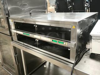 Brand new Prince Castle 33"W freestanding warming unit, model DHB2PT-33KFCB, with two 24" compartments, 208-240v/1ph.