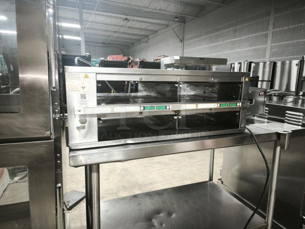 Brand new Prince Castle DHB2PT-33KFCB warming unit, 33"W, with two 24" compartments, freestanding, 208-240v/1ph.