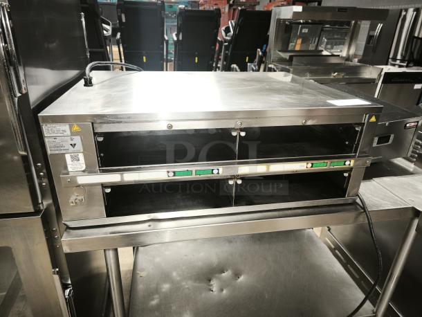 Brand new Prince Castle DHB2PT-33KFCB warming unit, 33"W, freestanding, two 24" compartments, 208-240v/1ph.