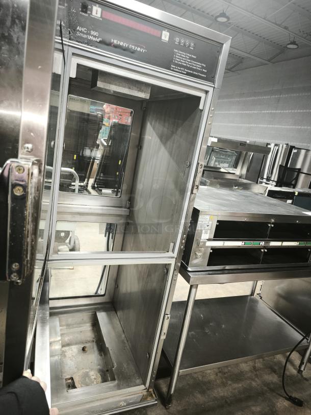 Brand new Henny Penny AHC-990 SmartHold heated holding cabinet on casters, 240v/1ph, empty interior, visible controls.
