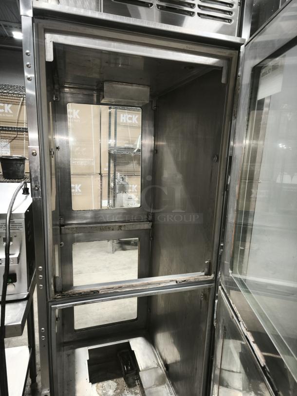 Brand new Henny Penny Smart Hold AHC-990 heated holding cabinet on casters, 240v/1ph, stainless steel interior.