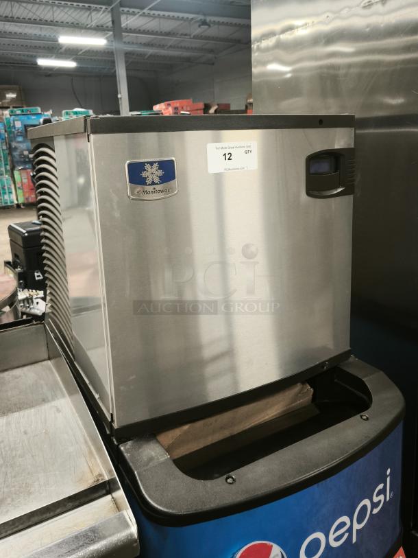 Manitowoc IYT0620A-161 Indigo NXT ice machine, 22" air-cooled, half dice, 115V, like new, stainless steel exterior, label visible.