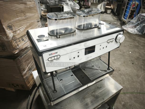 Brand new Schaerer Coffee Barista 349.BARISTA automatic espresso machine, stainless steel finish, dual hoppers, intact labels.