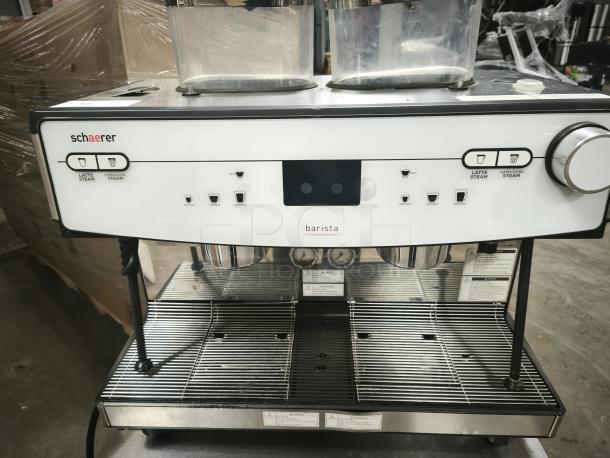 Brand new Schaerer Coffee Barista automatic espresso machine, model 349.BARISTA, with dual steam functions and sleek design.