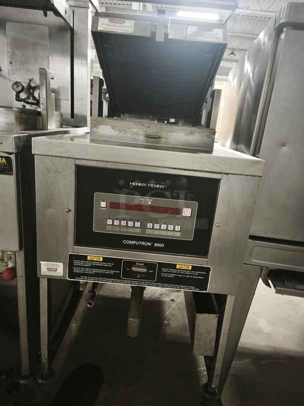 USED Henny Penny Computron 8000 Pressure Fryer, stainless steel, with visible control panel and caution labels, functional condition.