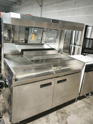 Delfield commercial stainless steel food warmer, new condition, with dual cabinet doors and visible Delfield branding.