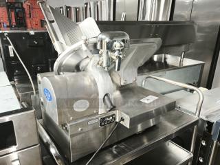 Brand new Globe 3875V 12" commercial meat slicer; stainless steel, powerful motor, precision slicing, blue Globe logo.