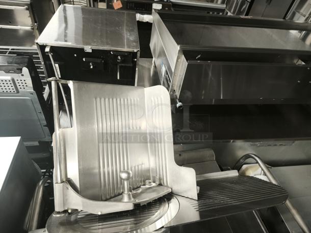 Brand new Globe 3875V 12" commercial meat slicer, sleek stainless steel design, ideal for precise slicing.