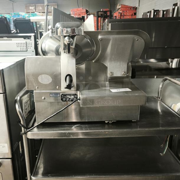 Brand new Globe 3875V 12" commercial meat slicer, stainless steel, with visible model and specification labels.