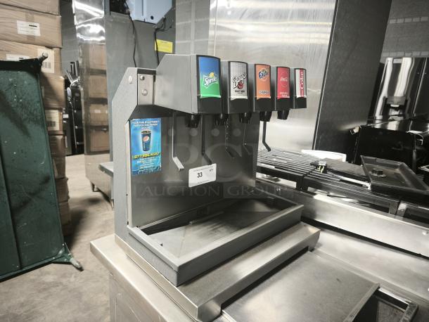 Lancer 41225 drop-in ice-cooled soft drink dispenser with 5 valves, featuring brand labels; table not included.