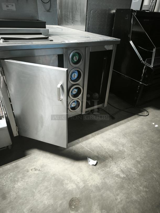 S&G Manufacturing BC7-1543 stainless steel corner table, open cabinet door, integrated cup dispensers, good condition.