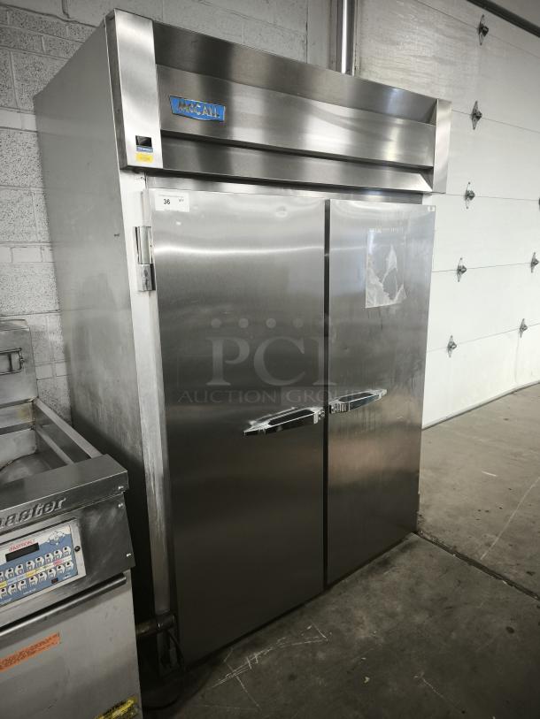 McCall 4-4045F commercial 2-door reach-in freezer in stainless steel, solid doors, good condition, logo visible on top.