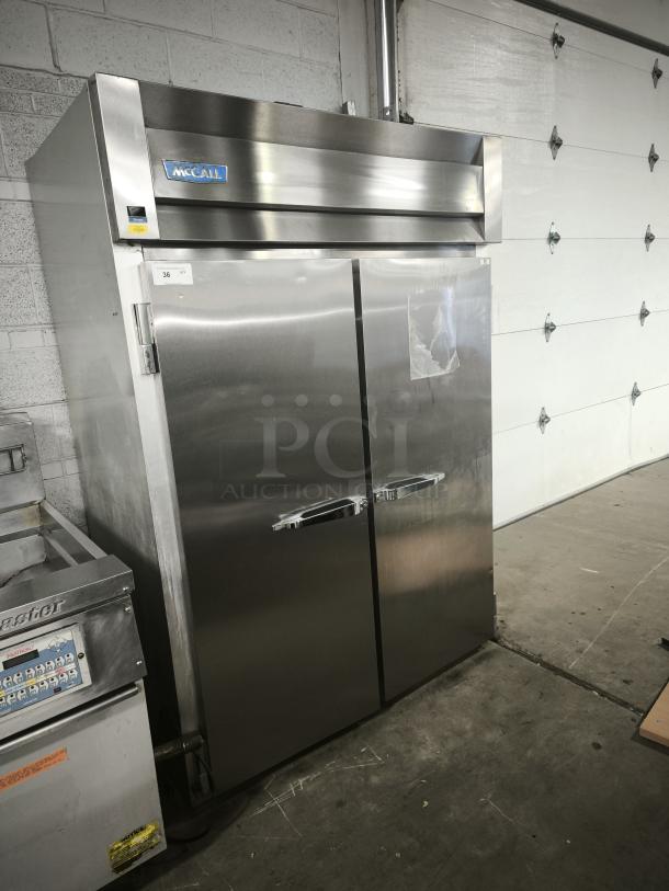 McCall 4-4045F commercial 2-door reach-in freezer, stainless steel, solid doors, visible model label, excellent condition.