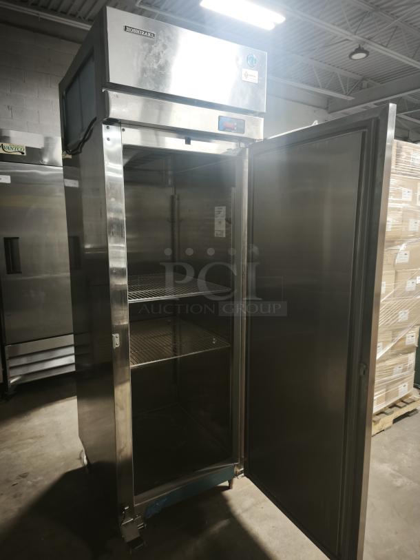 Hoshizaki Professional Series upright freezer, model FH1-SSB, like new condition, stainless steel door, open with shelves.