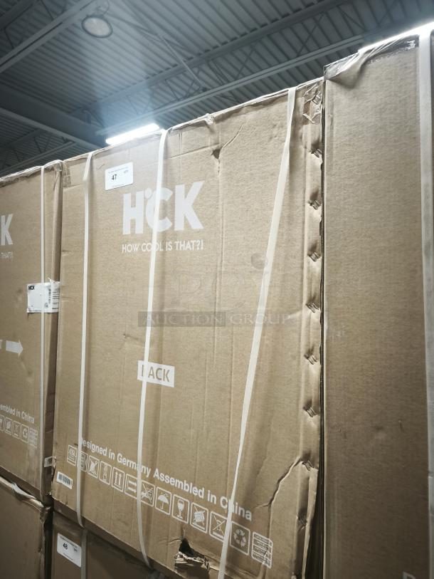 HCK D150-D fridge box, 5.12 cu.ft, dual zone. Features branding and "Designed in Germany Assembled in China." Box in new condition.