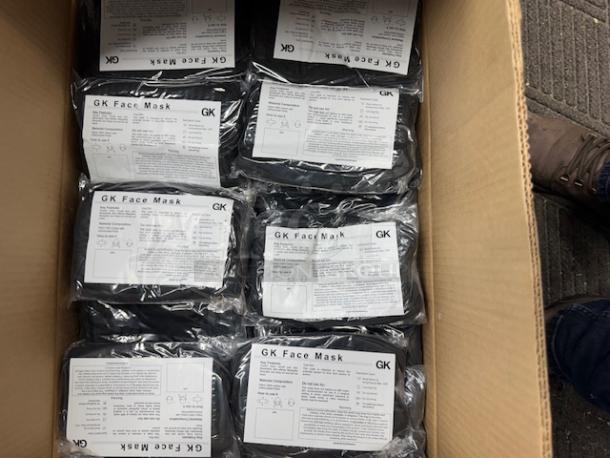 Box of GK 3-ply black face masks with antimicrobial finish, 600 masks total, each pack contains 10 masks.