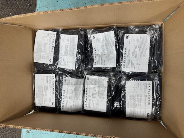 Box of GK brand, black 3-ply face masks with antimicrobial finish, 60 packs of 10 masks each, total 600 masks, labeled packages.