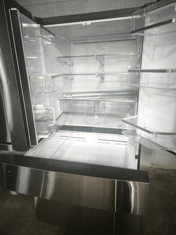 Used GE Profile™ 28.7 Cu. Ft. smart fingerprint-resistant 4-door French-door refrigerator with AutoFill pitcher, model PGE29BYTFS.