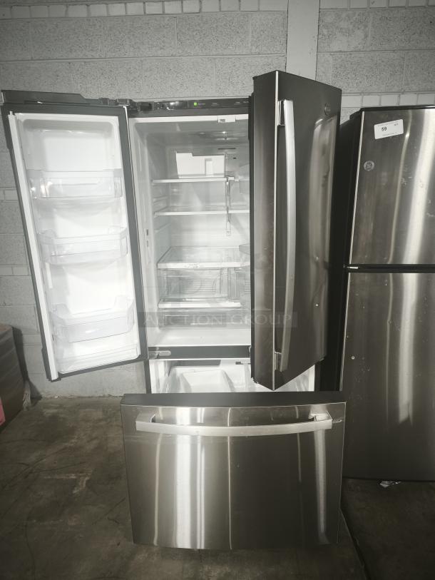 GE 27.7 Cu. Ft. French-Door Refrigerator, stainless steel, fingerprint-resistant, used, open doors, spacious interior.