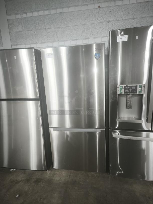 Midea 18.7 cu. ft. Bottom-Mount Freezer Refrigerator, model MRB19B7AST, in like-new condition. Stainless steel finish.