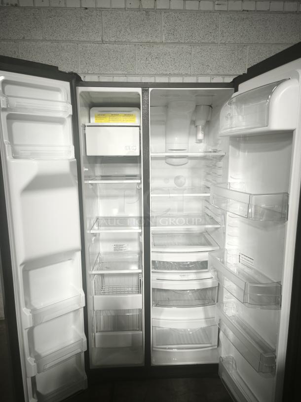 GE 25.1 cu. ft. side-by-side refrigerator, model GSS25IYNFS, fingerprint-resistant, used, working condition, interior view.