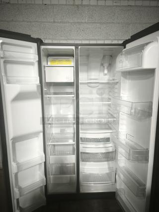 GE 25.1 cu. ft. side-by-side refrigerator, model GSS25IYNFS, fingerprint-resistant, used, working condition, interior view.