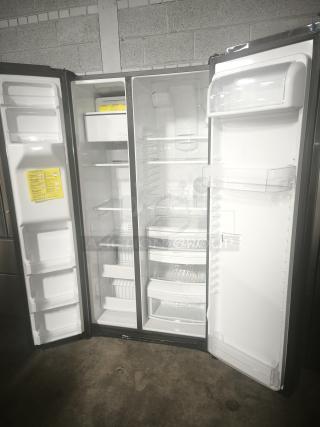 Used GE 25.1 cu. ft. fingerprint-resistant side-by-side refrigerator, model GSS25IYNFS, open doors, excellent condition.