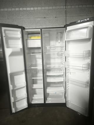 Used GE 25.1 cu. ft. Side-by-Side Refrigerator, Model GSS25IYNFS, fingerprint-resistant, open doors, clean interior.