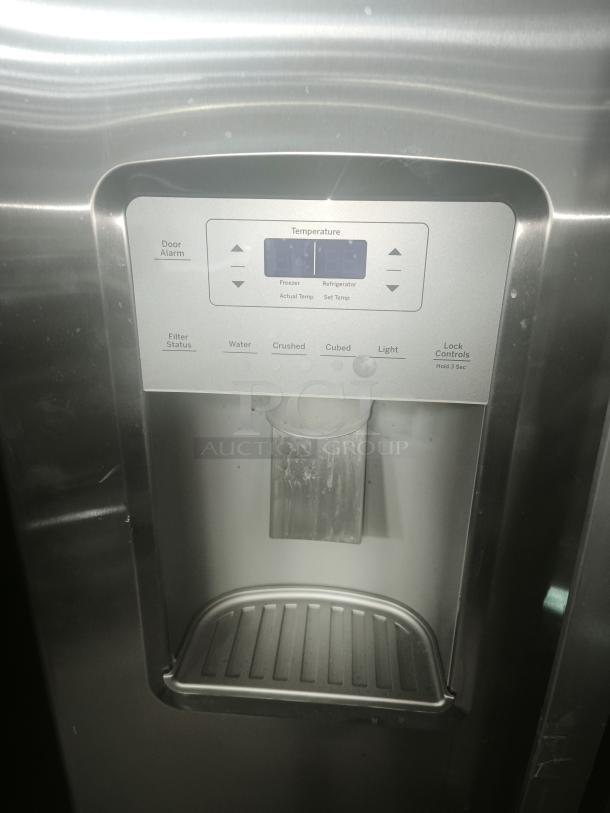 GE 25.1 cu. ft. fingerprint-resistant side-by-side refrigerator, model GSS25IYNFS, with control panel and dispenser. Used condition.