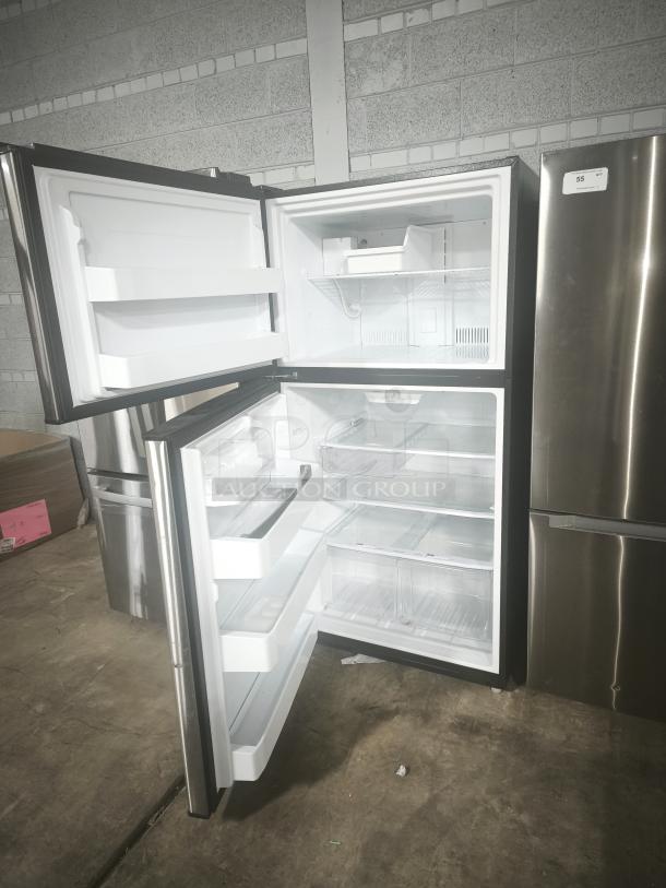 Used GE Energy Star® 21.1 cu. ft. top-freezer refrigerator, Model GIE21GSHSS. Clean interior, shelves, and door bins visible.