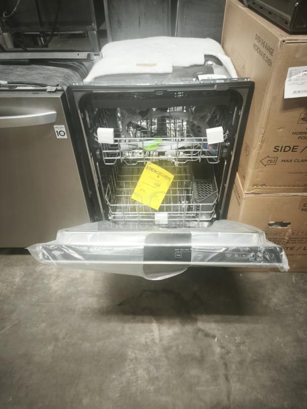 Brand new Whirlpool 24" top control built-in tub dishwasher, model WDTA50SAKZ3. Features 3rd rack, AI wash, 47 dBA, stainless steel finish. Energy guide visible.