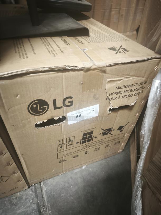 Box for LG microwave oven, partially visible. Not the GE model described. Packing symbols and handling instructions visible.