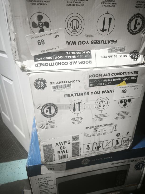 Brand new GE Profile 2.1 Cu. Ft. Over-the-Range Sensor Microwave Oven in box, Model AWFS05BWL.