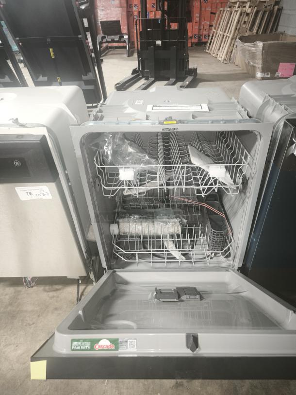 NEW GE ENERGY STAR® Dishwasher, Model GDF535PSRSS, front controls, silver interior, pristine condition, includes packaging.