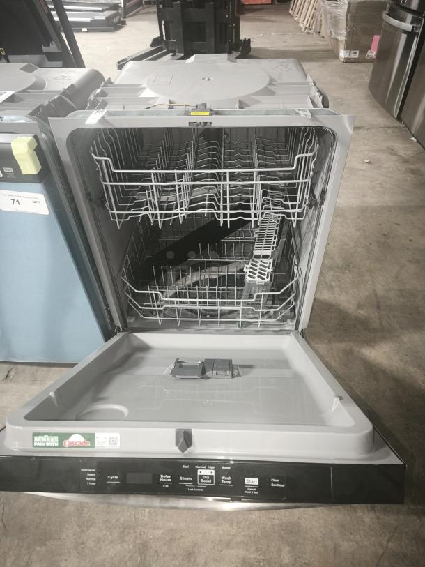 NEW GE GDT550PYRFS dishwasher, top control, plastic interior, sanitize cycle, Dry Boost™, pristine condition, labels visible.