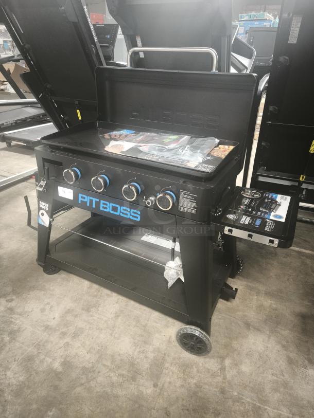 Pit Boss Ultimate 4-Burner Lift-Off Griddle, model 10782, brand new condition with tags, black with blue accents.
