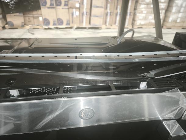 Brand new GE 1.7 Cu. Ft. over-the-range sensor microwave oven, model JVM6175SKSS, with protective film intact.