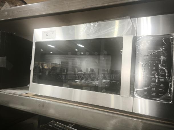 BRAND NEW GE JVM7195SK6SS Over-the-Range Microwave, 1.9 Cu. Ft., stainless steel finish, control panel features. Tag: Item 92.