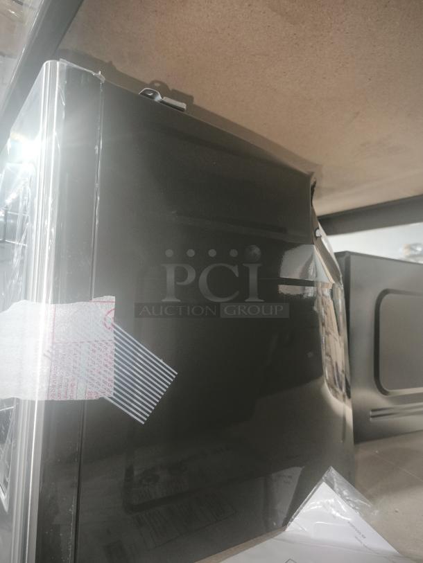 Brand new GE 1.9 Cu. Ft. Over-the-Range Microwave Oven, Model JVM7195SK6SS, shown with protective cover intact.