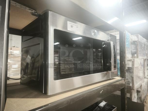 Brand new GE 1.6 Cu. Ft. over-the-range microwave, model JVM3160RF9SS, stainless steel, on warehouse shelf.