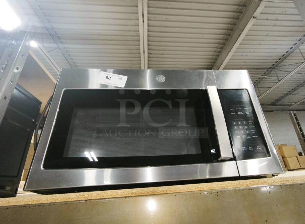 BRAND NEW GE 1.6 Cu. Ft. Over-the-Range Microwave Oven, Model JVM3162RJ6SS, stainless steel finish, intact tags visible.