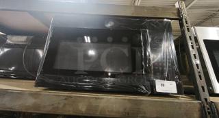 BRAND NEW GE 1.6 Cu. Ft. Over-the-Range Microwave, Model JVM3160DF9BB. Factory-sealed, auction label visible.