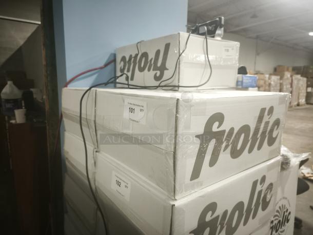 Boxes of brand new Frolic Ice Cream Maker, model Frolic Machine, stacked in warehouse; labels indicate auction lots 101 and 102.
