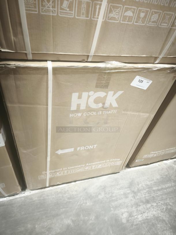 New HCK D150-D undercounter dual zone fridge, 5.12 cu.ft, in original box. Label shows "How Cool Is That?!" and assembly details.