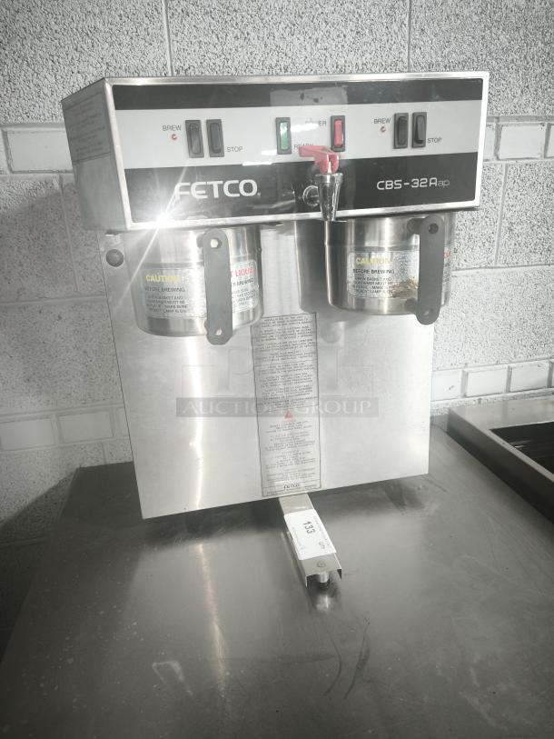Fetco CBS-32Aap stainless dual coffee brewer, 120/208-240V, tested and working, features brew/stop switches, caution labels.