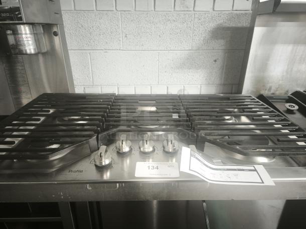 Profile 36 in. gas cooktop, model PGP7036SLSS, stainless steel, like new, 5 burners, features power boil burners.